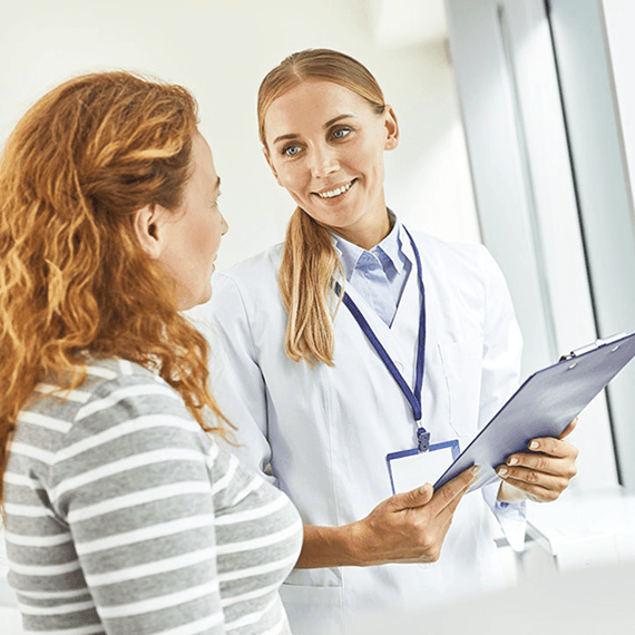 A doctor listening to a patient