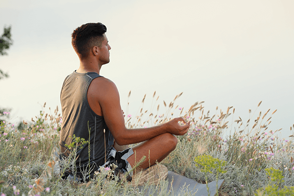 A man meditating in nature