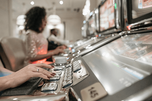 A woman playing a slot machine
