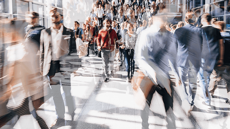 Busy people walking in different directions