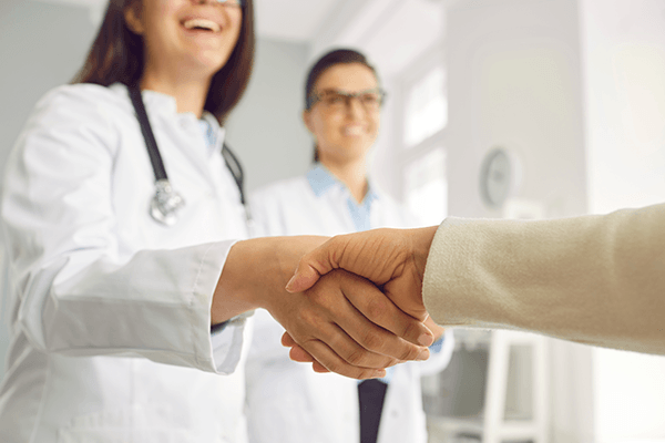 Clinician shaking a paitents hand