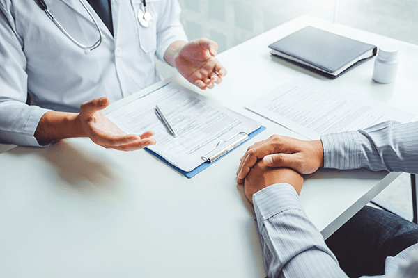 A doctor giving a consultation to a patient