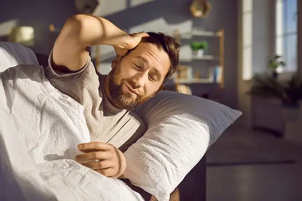 A tired man in bed