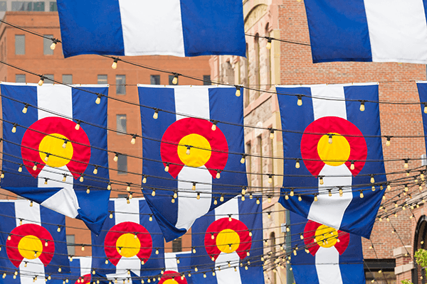 A town square filled with Colorado flags